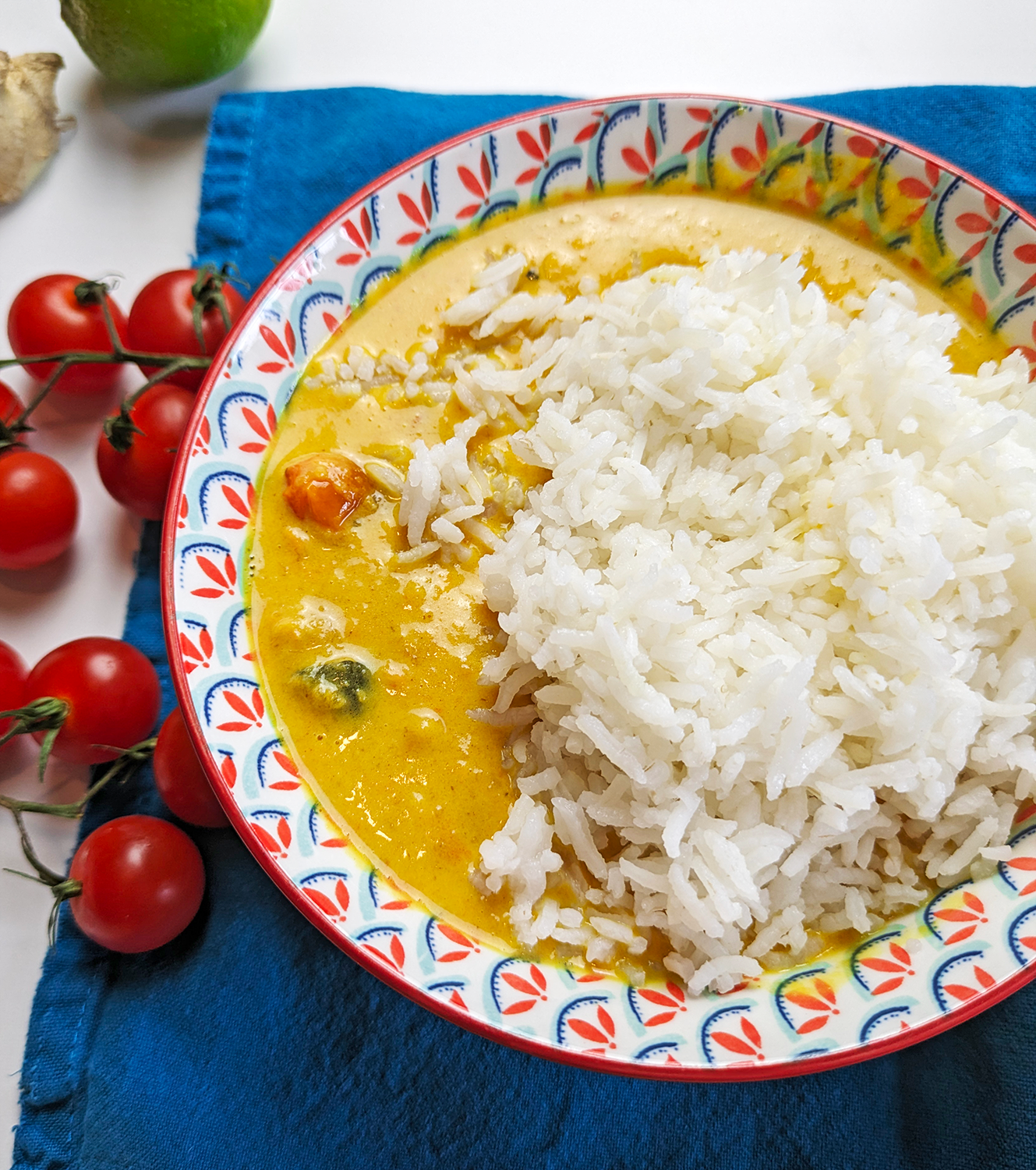 Roasted Vegetable Curry with a creamy Coconut sauce and chickpeas. Served in a bowl with rice. 